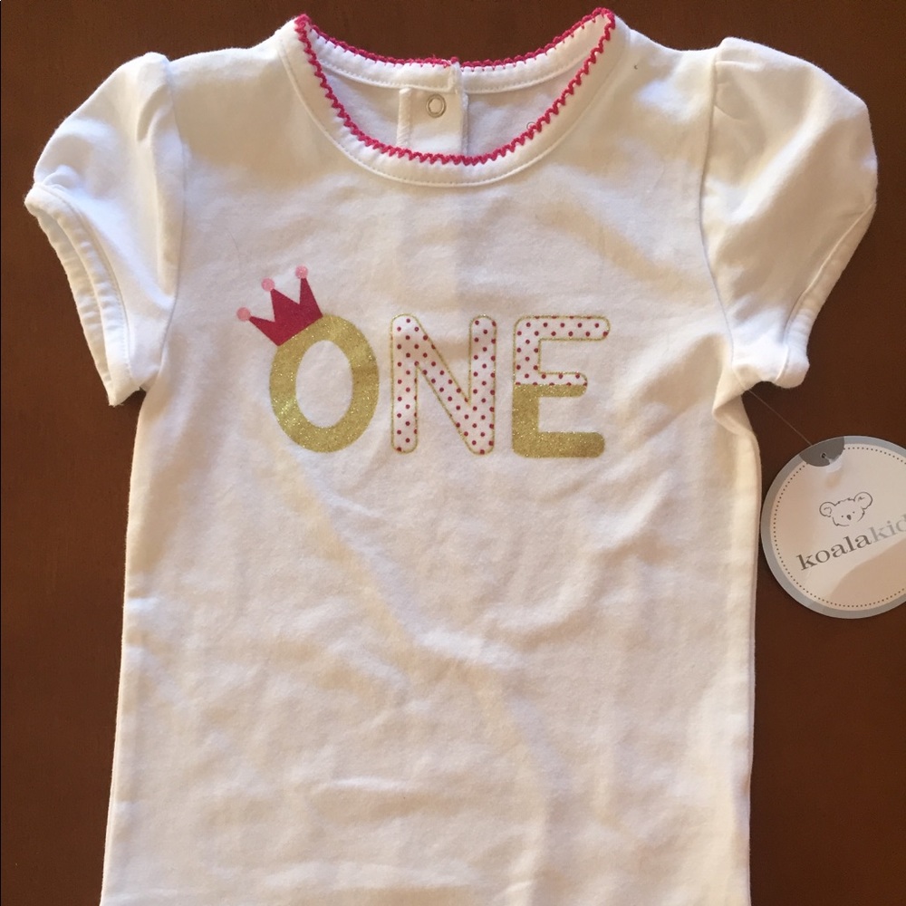 Baby onesie decorated for 1st birthday.